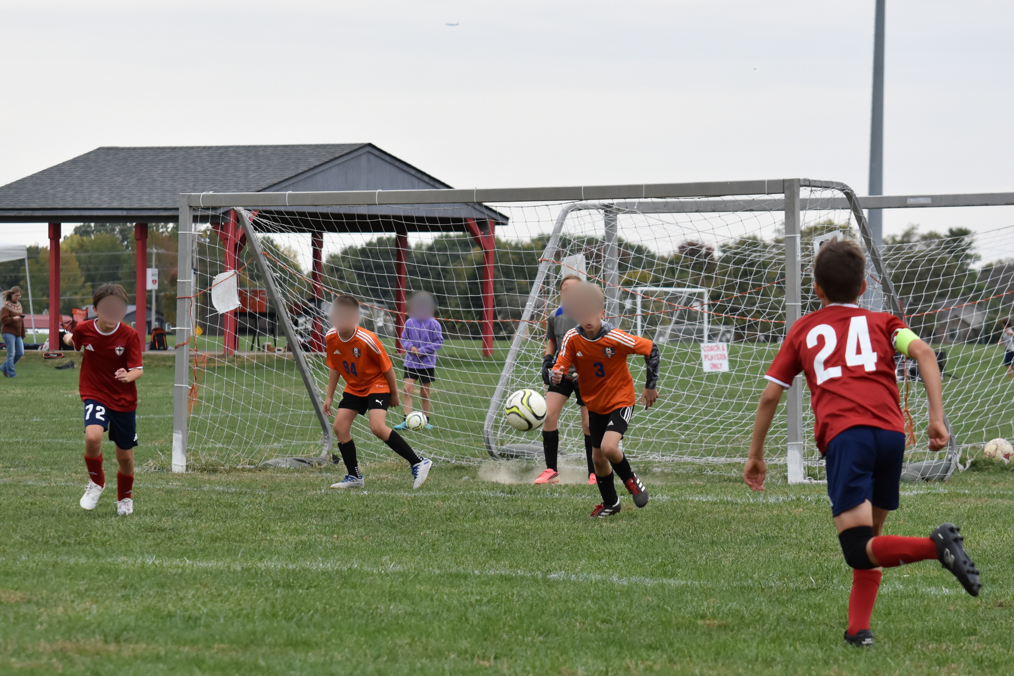 Kids playing soccer in a championship game